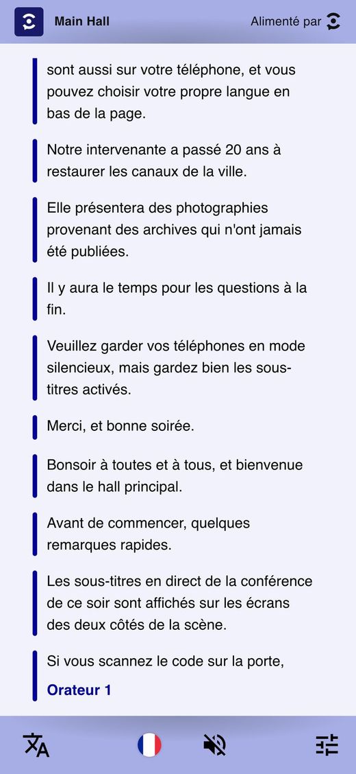 A phone showing live captions in French